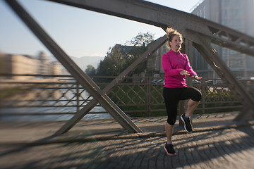 Image showing woman  stretching before morning jogging