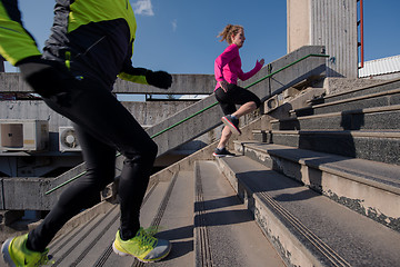 Image showing young  couple jogging on steps