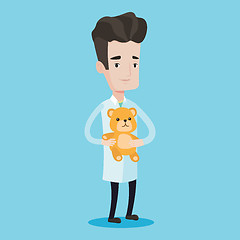 Image showing Pediatrician doctor holding teddy bear.