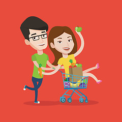 Image showing Couple of friends riding by shopping trolley.