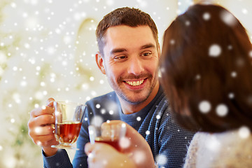 Image showing happy couple drinking tea at cafe