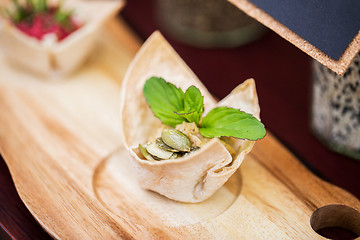 Image showing close up of dough cornet with filling