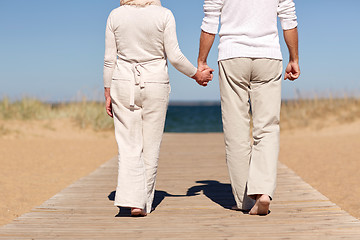 Image showing close up of senior couple on summer beach