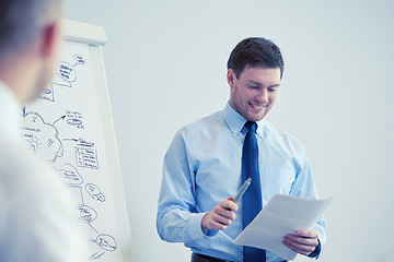 Image showing group of smiling businessmen meeting in office