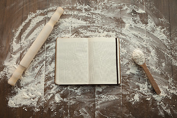Image showing Recipe book on floured table.