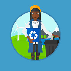 Image showing Woman with recycle bin and trash can.