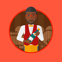 Image showing Waiter holding bottle in wine cellar.