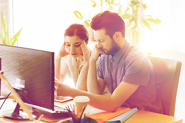 Image showing creative team with reading paper in office