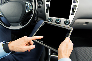 Image showing close up of man with tablet pc in car