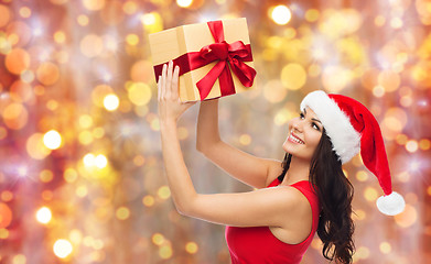 Image showing beautiful sexy woman in santa hat with gift box