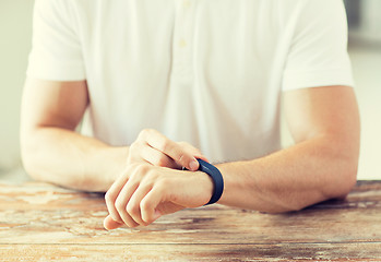 Image showing close up of man with heart-rate watch