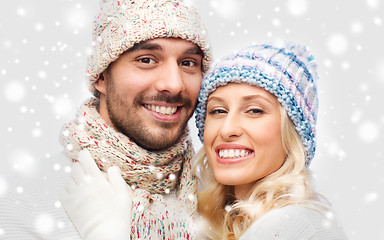 Image showing smiling couple in winter clothes hugging