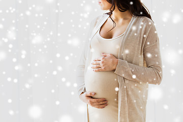 Image showing close up of pregnant woman looking to window