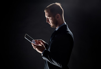 Image showing close up of businessman with transparent tablet pc