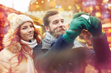 Image showing couple taking selfie with smartphone in old town