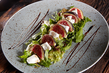 Image showing Fig, Goat cheese and rocket salad