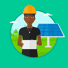 Image showing Female worker of solar power plant.