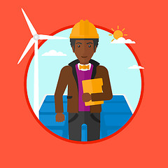 Image showing Male worker of solar power plant and wind farm.