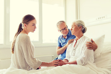 Image showing family visiting ill senior woman at hospital