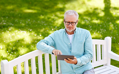 Image showing senior man with tablet pc at summer park