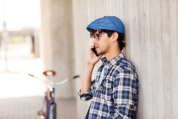 Image showing man with smartphone and fixed gear bike on street