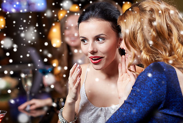 Image showing happy women gossiping at night club over snow
