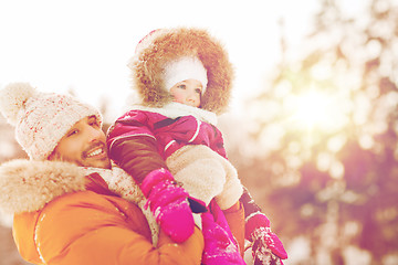 Image showing happy family in winter clothes outdoors