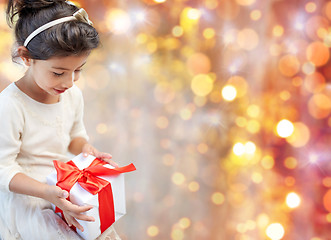 Image showing smiling little girl with gift box