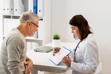 Image showing senior man and doctor meeting at hospital