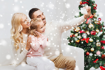 Image showing family taking selfie with smartphone at christmas