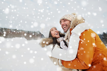 Image showing happy couple hugging outdoors in winter