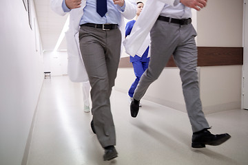 Image showing close up of medics or doctors running at hospital