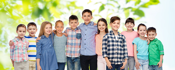 Image showing group of happy smiling children hugging