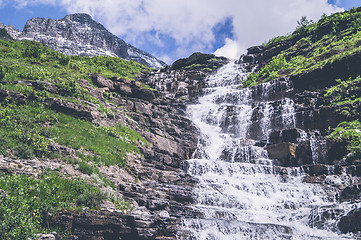 Image showing Mountain waterfall with rough cliffs