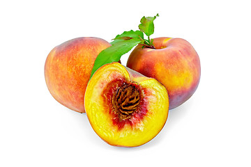 Image showing Peaches with green leaves