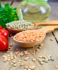 Image showing Lentils red in spoon on wooden board