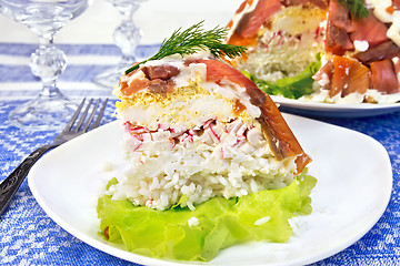 Image showing Salad with salmon and rice in plate on tablecloth