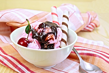 Image showing Ice cream cherry with wafer rolls on board