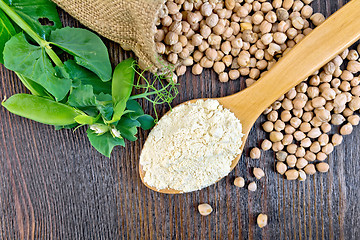 Image showing Flour chickpeas in spoonful with peas on board top