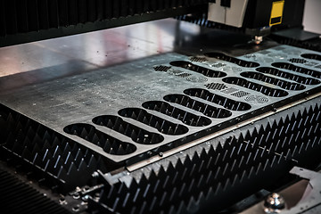 Image showing CNC Laser cutting of metal, modern industrial technology.