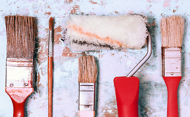 Image showing Set Of Paint Brushes On A Light Wooden Background