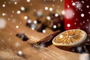 Image showing cinnamon, anise and dried orange on wooden board