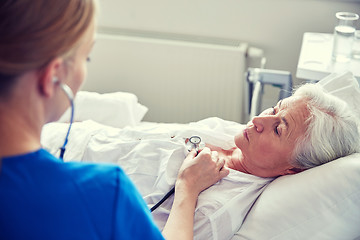 Image showing nurse with stethoscope and senior woman at clinic