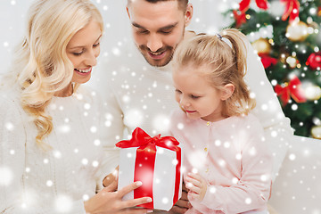 Image showing happy family at home with christmas gift box