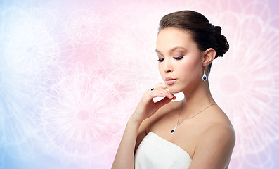 Image showing beautiful woman with earring, ring and pendant