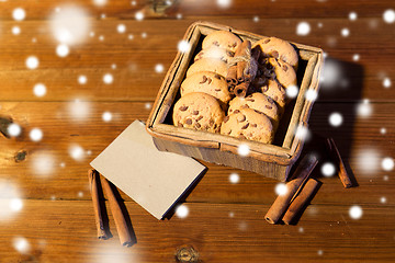 Image showing close up of oat cookies and card  on wooden table