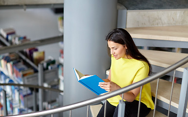 Image showing high school student girl reading book at library