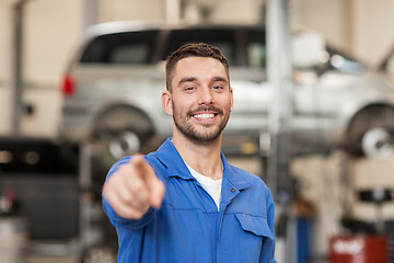 Image showing happy auto mechanic man or smith at car workshop