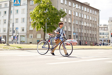 Image showing young man with fixed gear bicycle on crosswalk