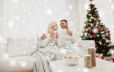 Image showing happy couple at home with christmas tree